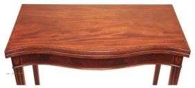 A mahogany serpentine fronted card table c1785shown opened out