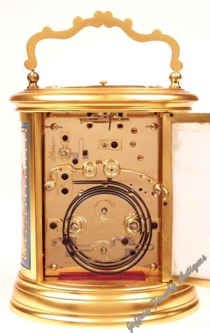 Back of oval French carriage clock with porcelain panels