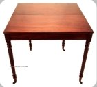 A mahogany tea table shown opened out c1820
